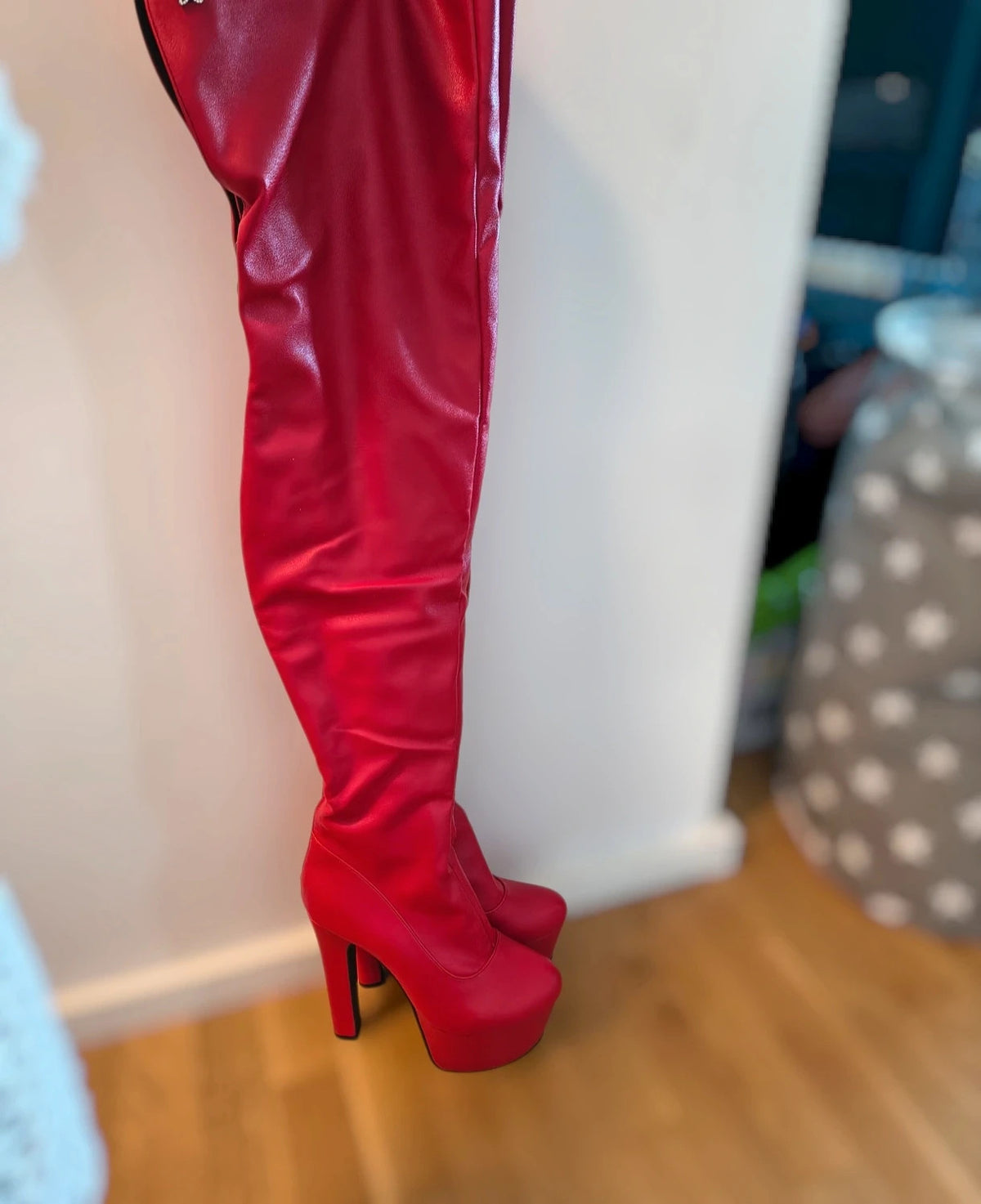 REI red overknee boots synthetic material with zipper and platform sole.