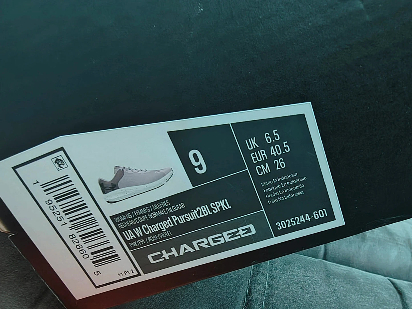Under Armour purple trainers synthetic material with logo detail and classic design.