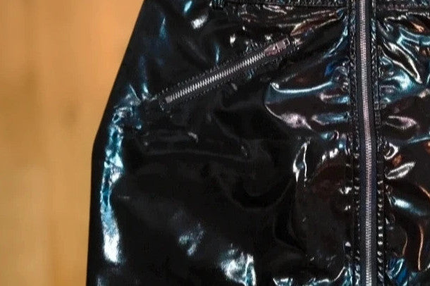 REI black mini skirt with zipper, synthetic latex look, size M, labeled as XL.