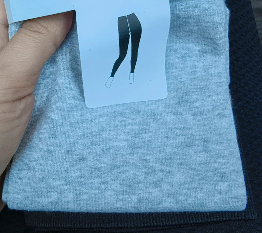 Calvin Klein grey bicycle tights with wide black logo waistband, fitted design.