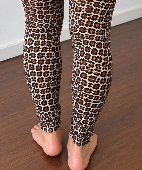 SheIn black and brown leopard print bicycle tights with elastic waistband and fitted design.