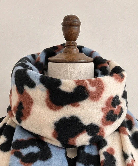 XXL multi shawl featuring plush leopard print in cream, light blue, black, and brown.