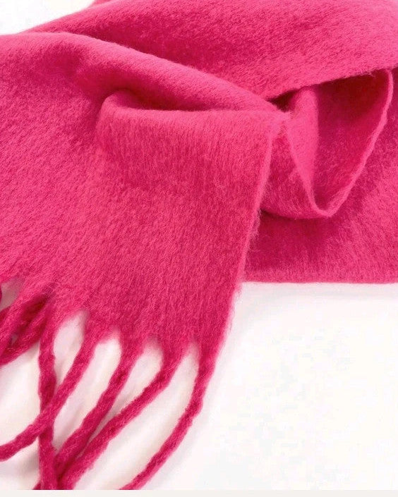 XXL pink fuchsia oversized scarf with long decorative fringes and soft fluffy texture.