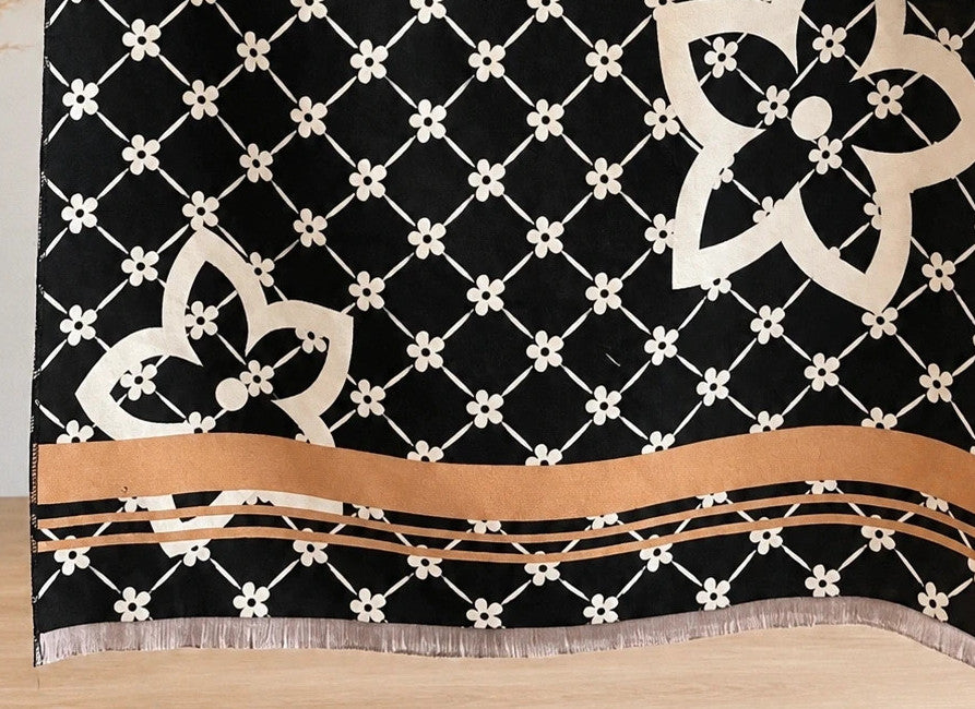 Creme shawl black cream beige floral pattern with decorative camel accents and fringes.