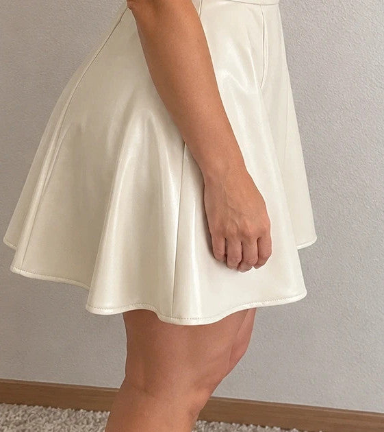 Creme bandage dress cream matte leather look deep V-neck backless with zippers.