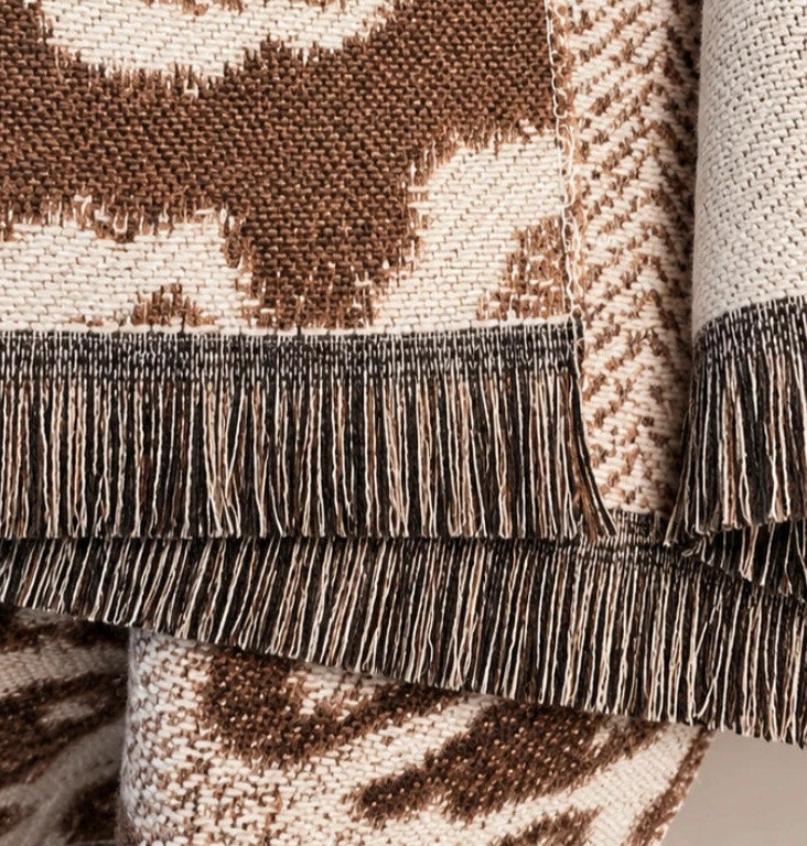 Muster beige brown shawl leopard pattern soft polyester with decorative fringes.