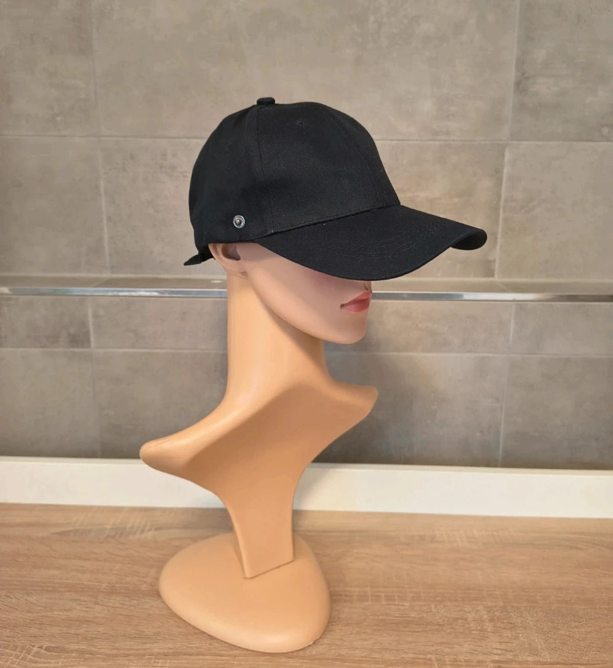 ohne black hat with side snap buttons, minimalist design, adult size