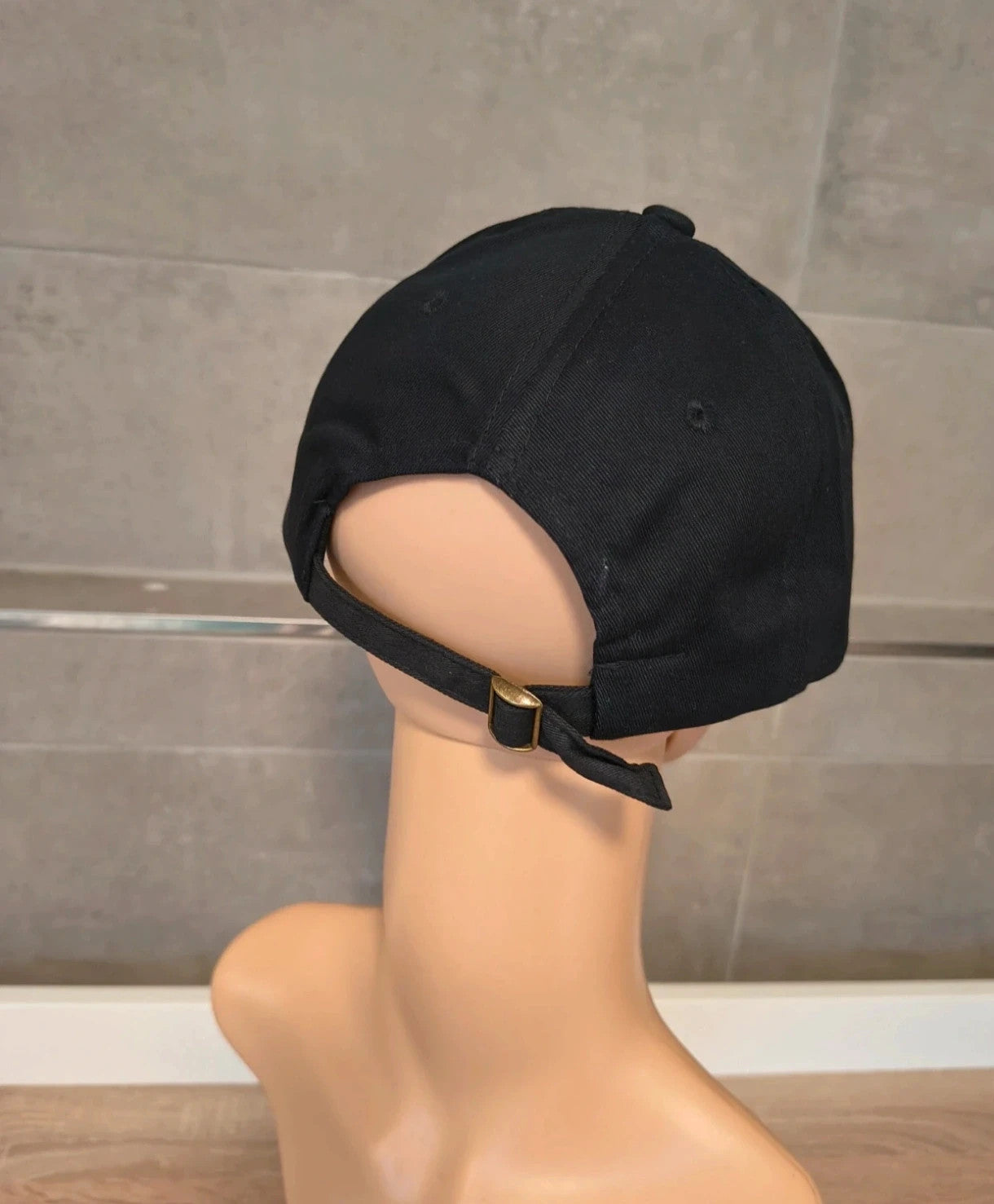 ohne black hat with side snap buttons, minimalist design, adult size