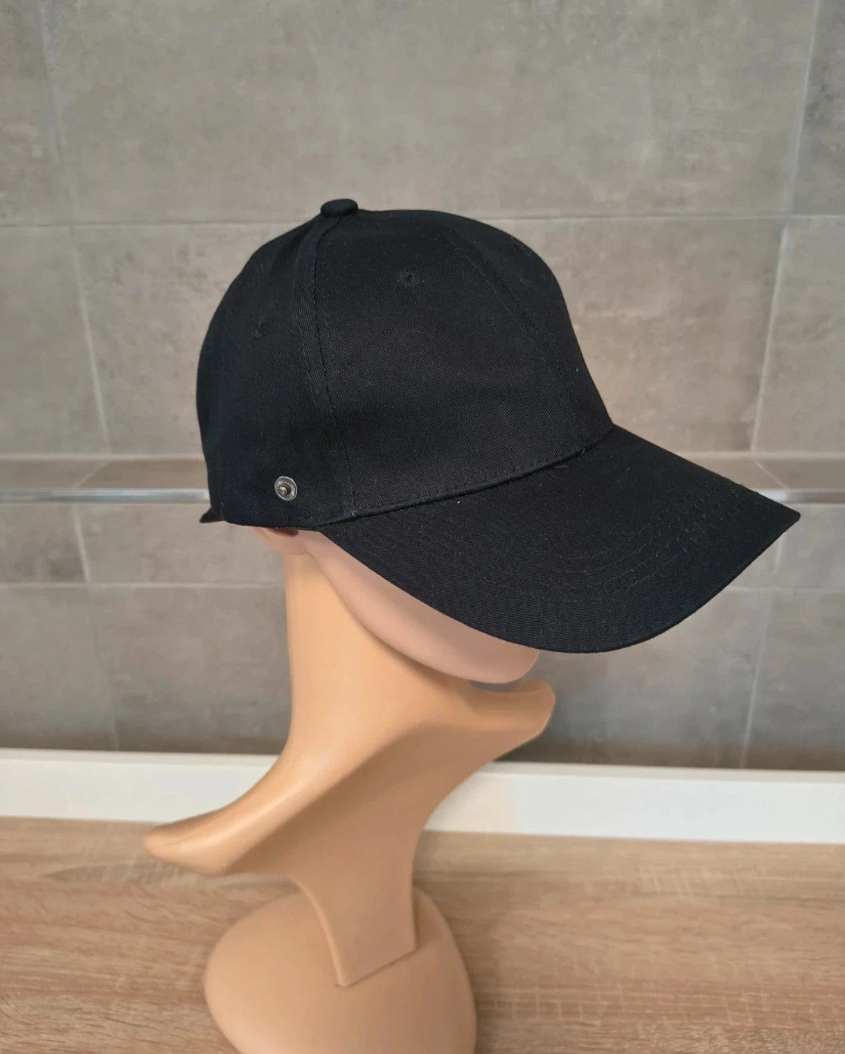 ohne black hat with side snap buttons, minimalist design, adult size