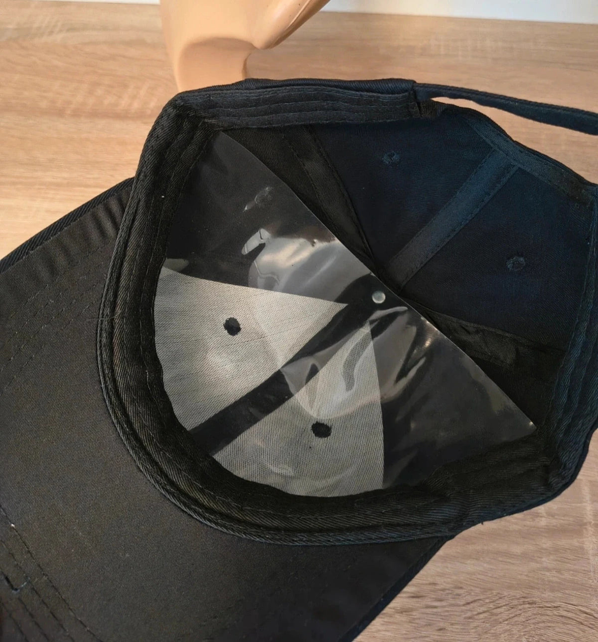 ohne black hat with side snap buttons, minimalist design, adult size