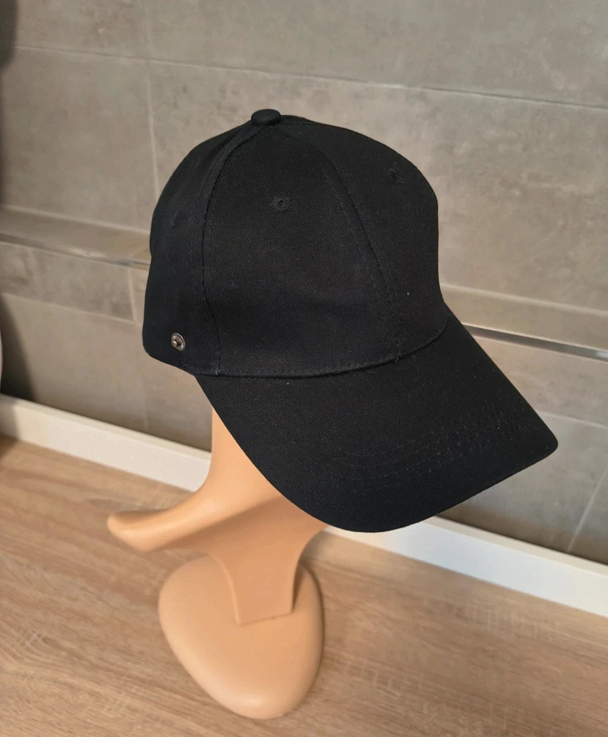ohne black hat with side snap buttons, minimalist design, adult size