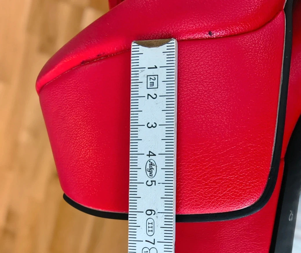 REI red overknee boots synthetic material with zipper and platform sole.