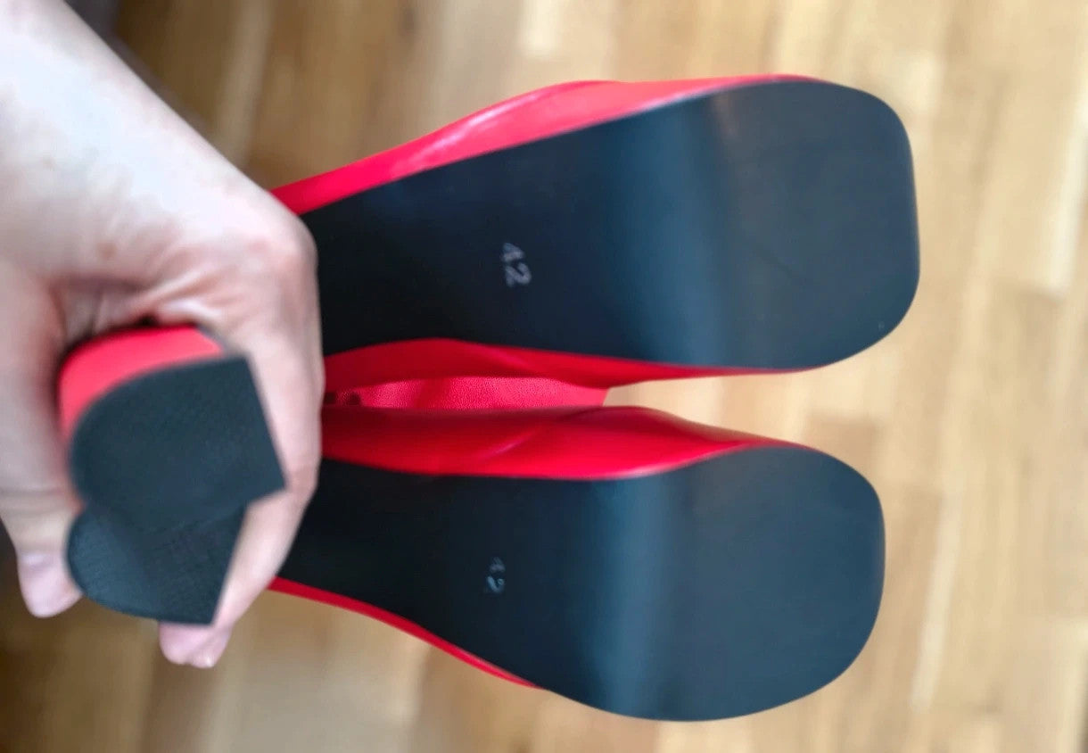 REI red overknee boots synthetic material with zipper and platform sole.