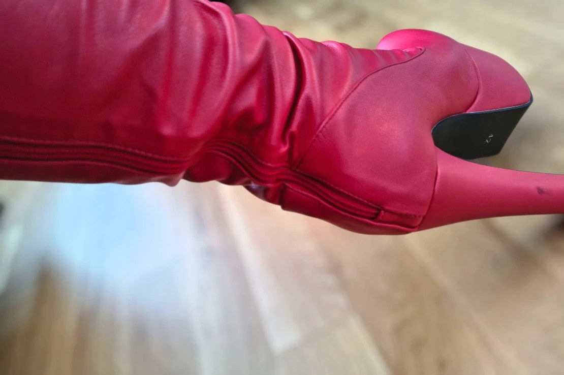 REI red overknee boots synthetic material with zipper and platform sole.
