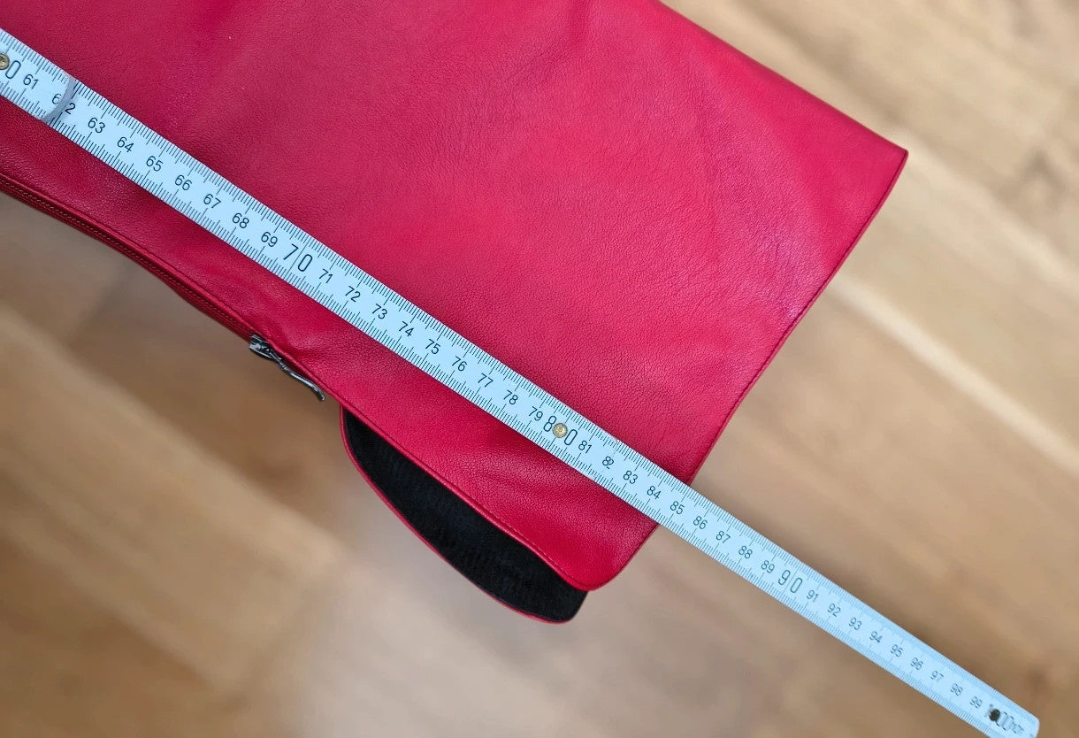 REI red overknee boots synthetic material with zipper and platform sole.