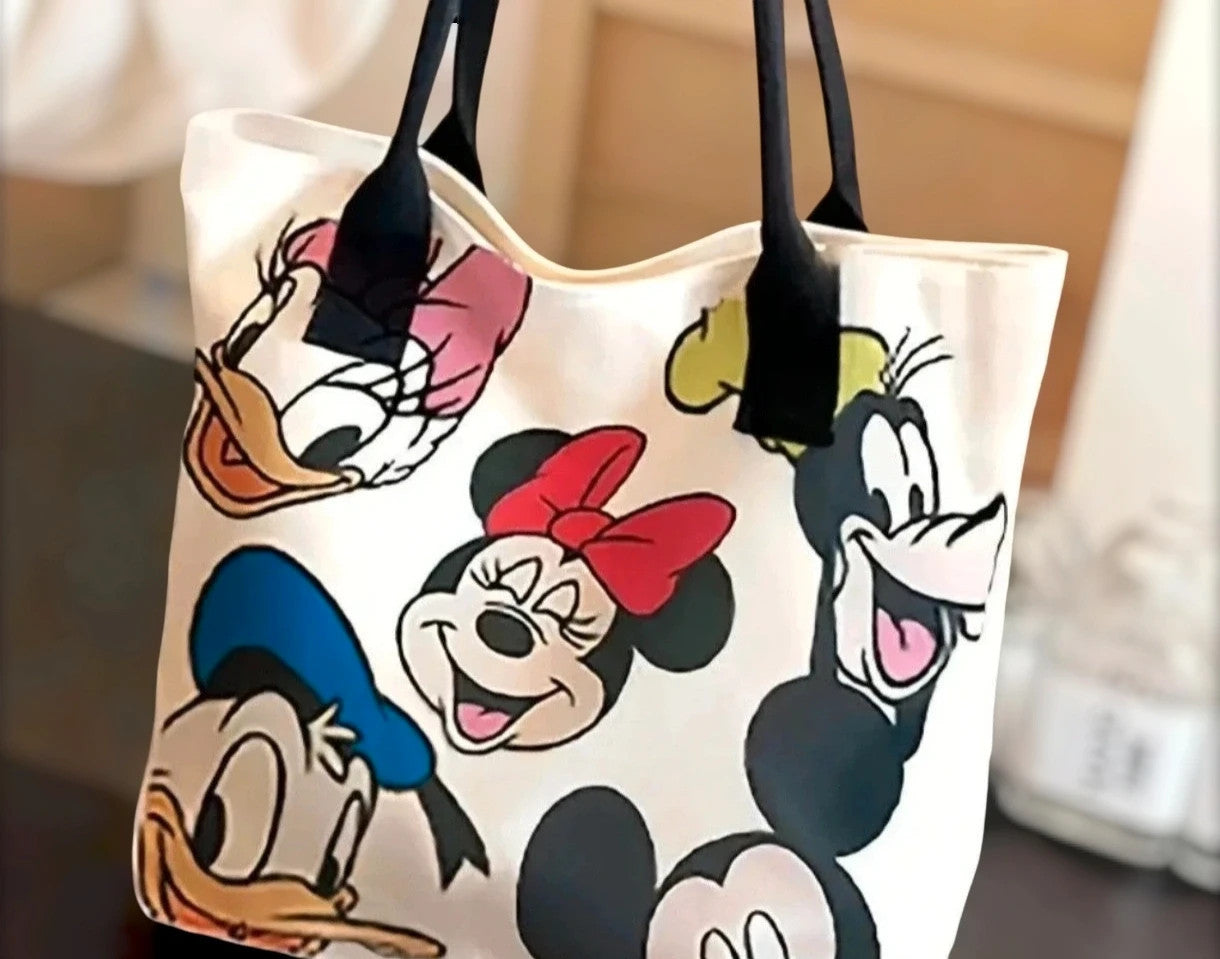 Cartoon cream shopping tote featuring Goofy design and synthetic material.