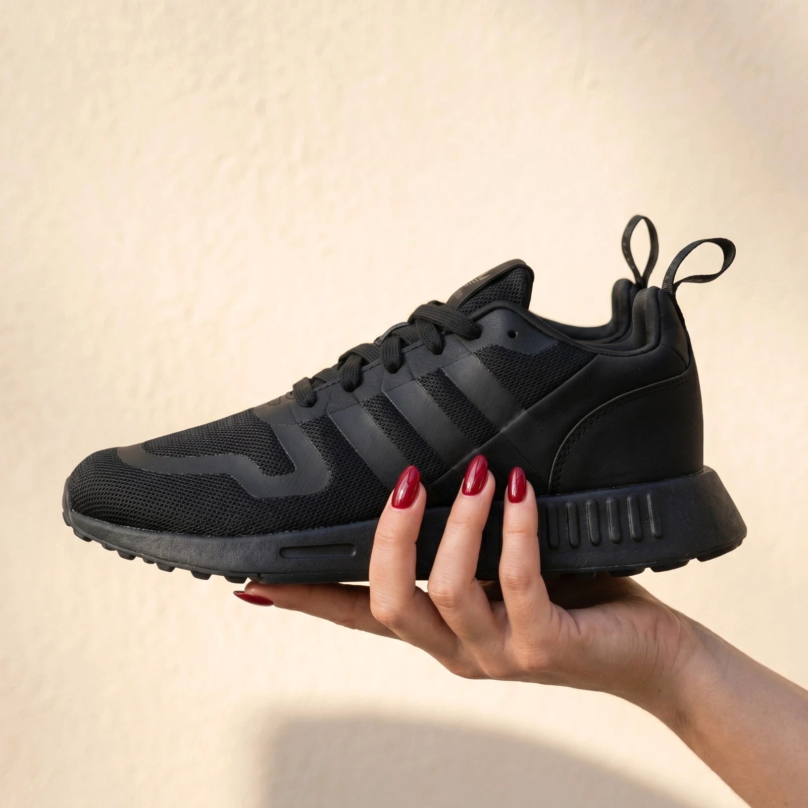 Adidas black trainers with synthetic and textile material, classic design, original box included.