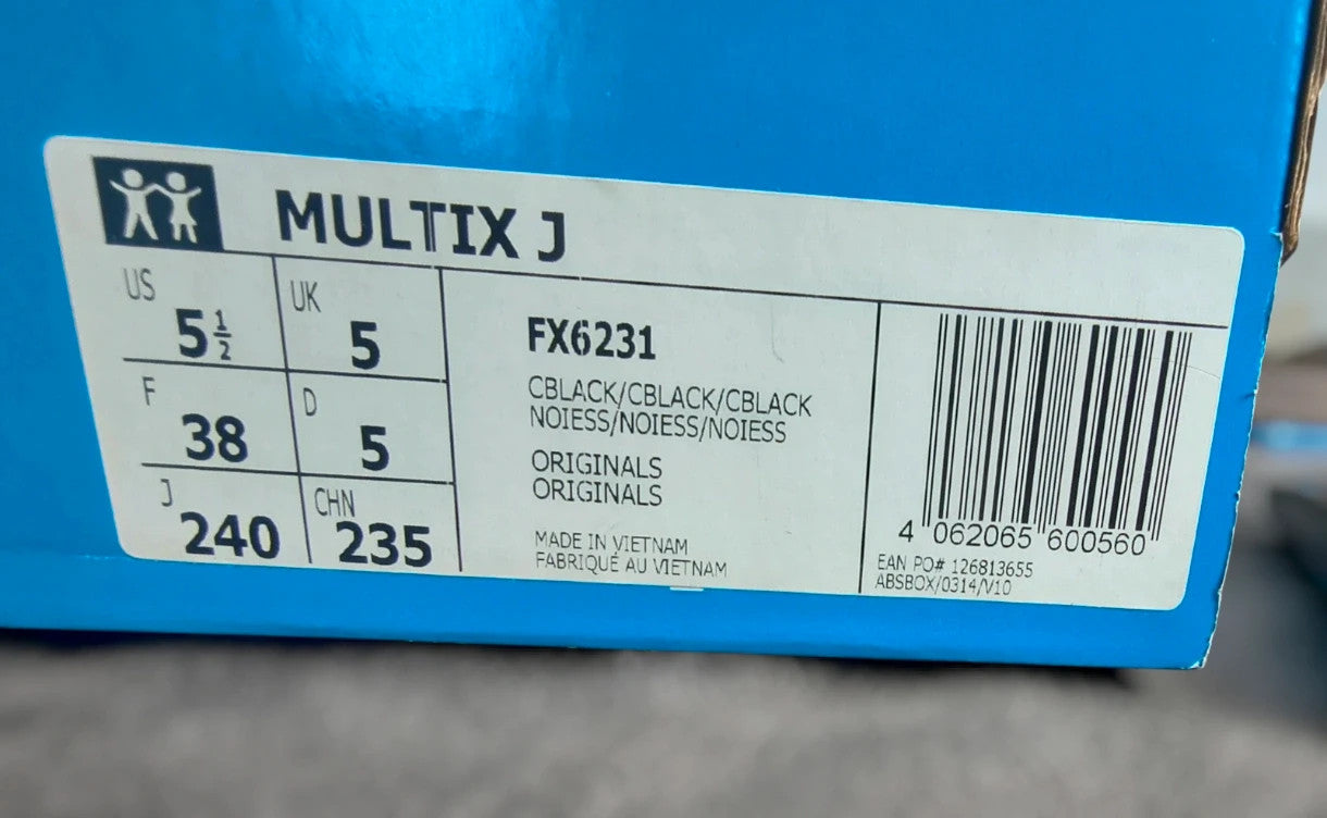 Adidas black trainers with synthetic and textile material, classic design, original box included.