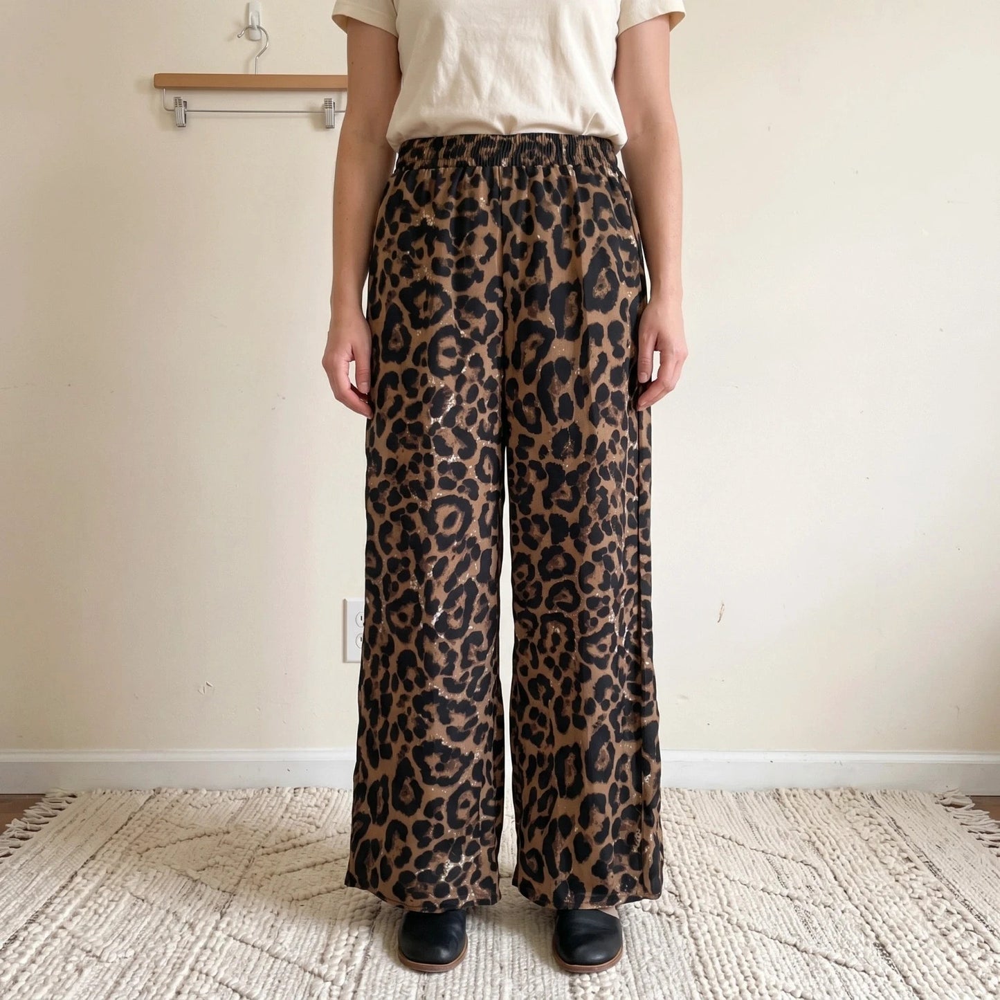 SheIn brown animal print flared pants synthetic material with leopard pattern.