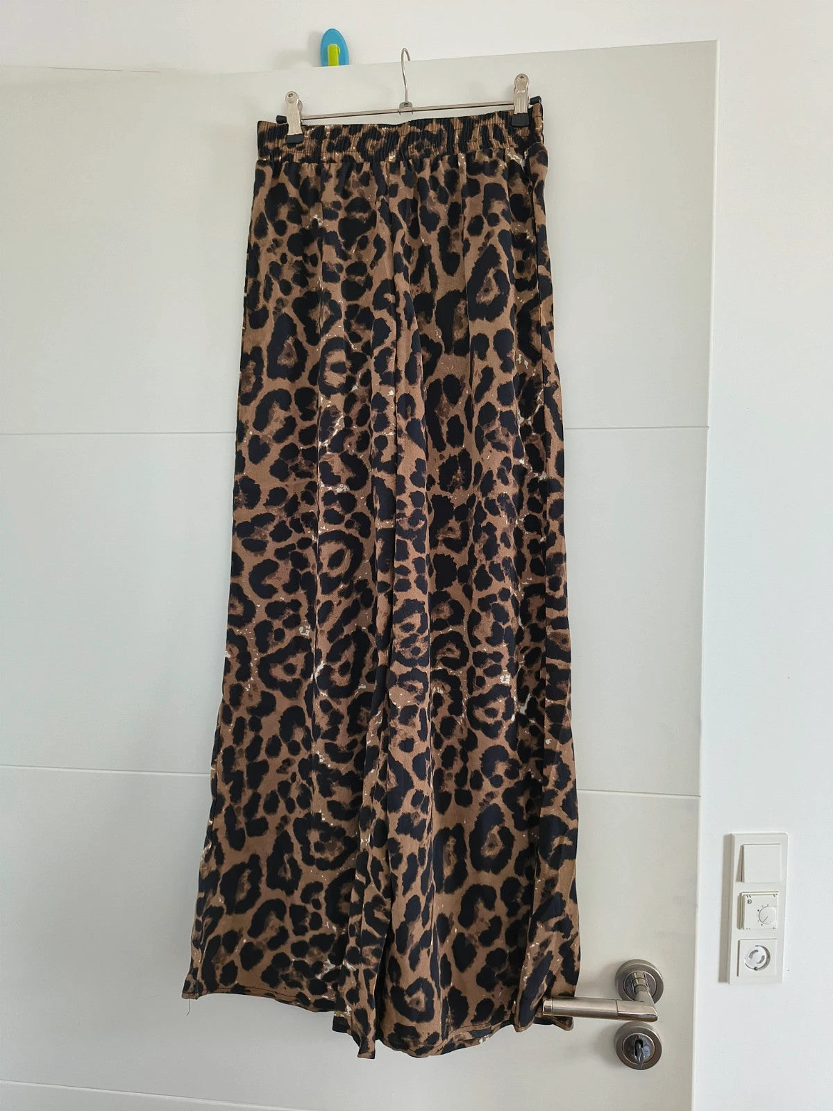 SheIn brown animal print flared pants synthetic material with leopard pattern.