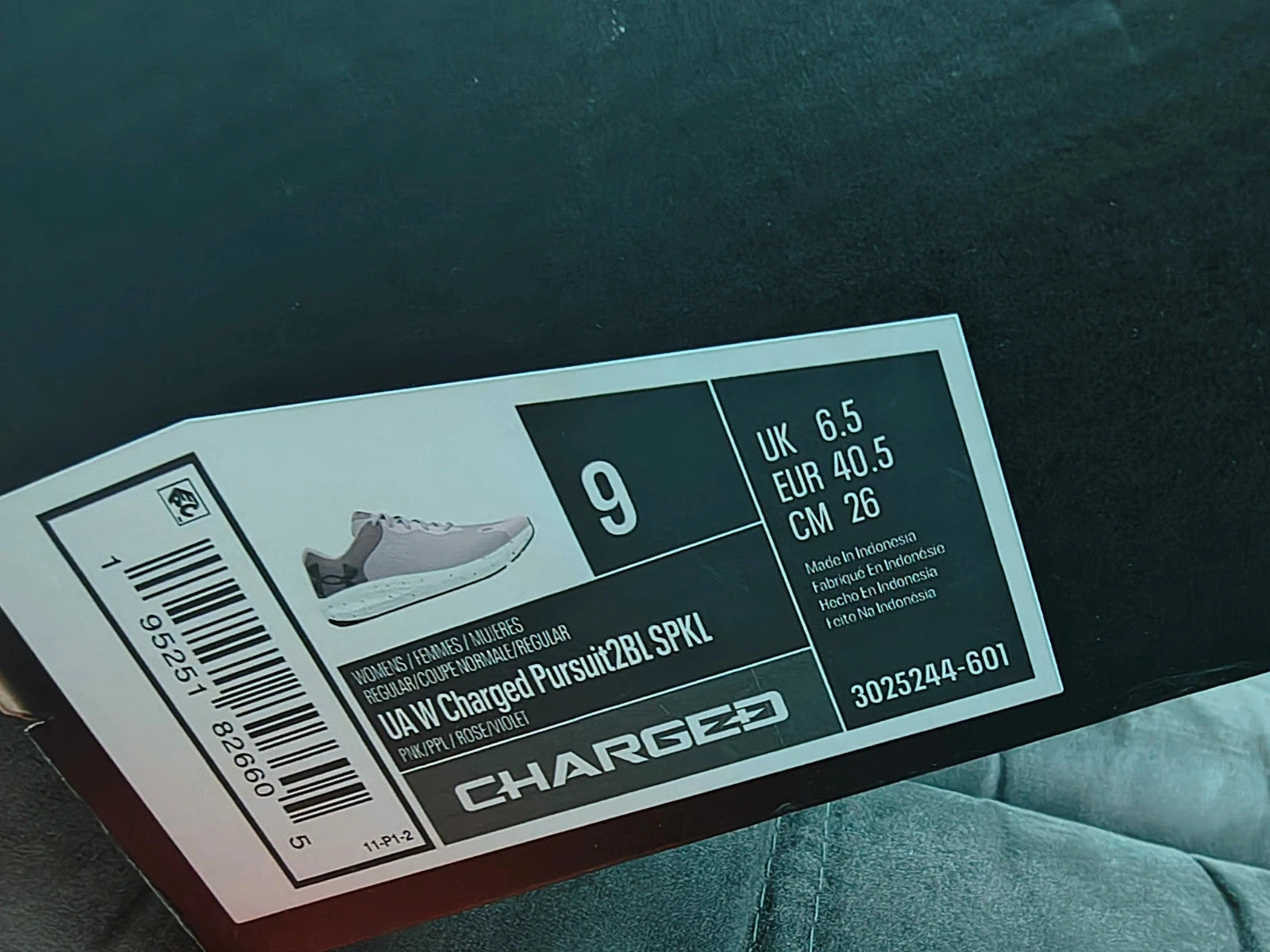 Under Armour purple trainers synthetic material with logo detail and classic design.