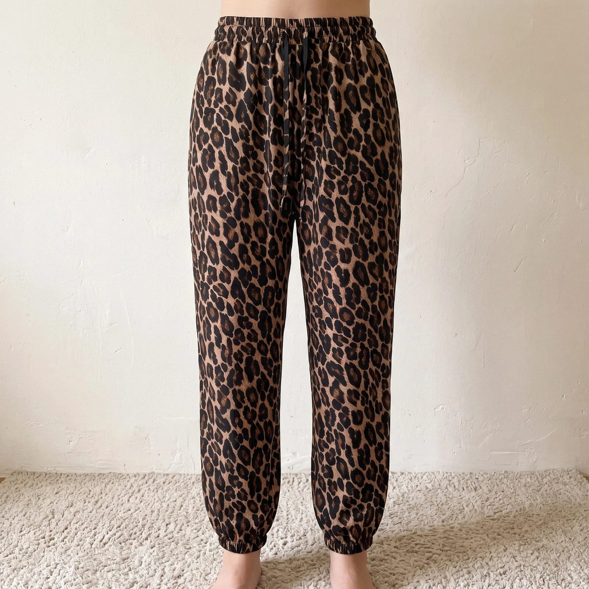 SheIn joggers black and brown leopard print synthetic material with elastic waistband.