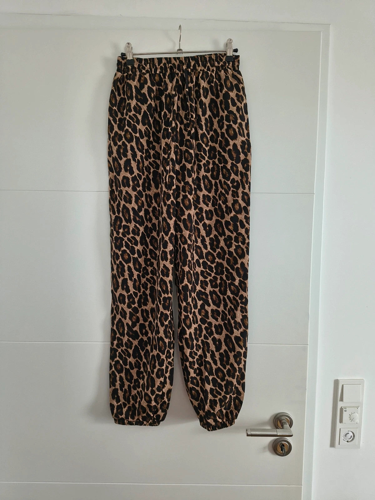 SheIn joggers black and brown leopard print synthetic material with elastic waistband.