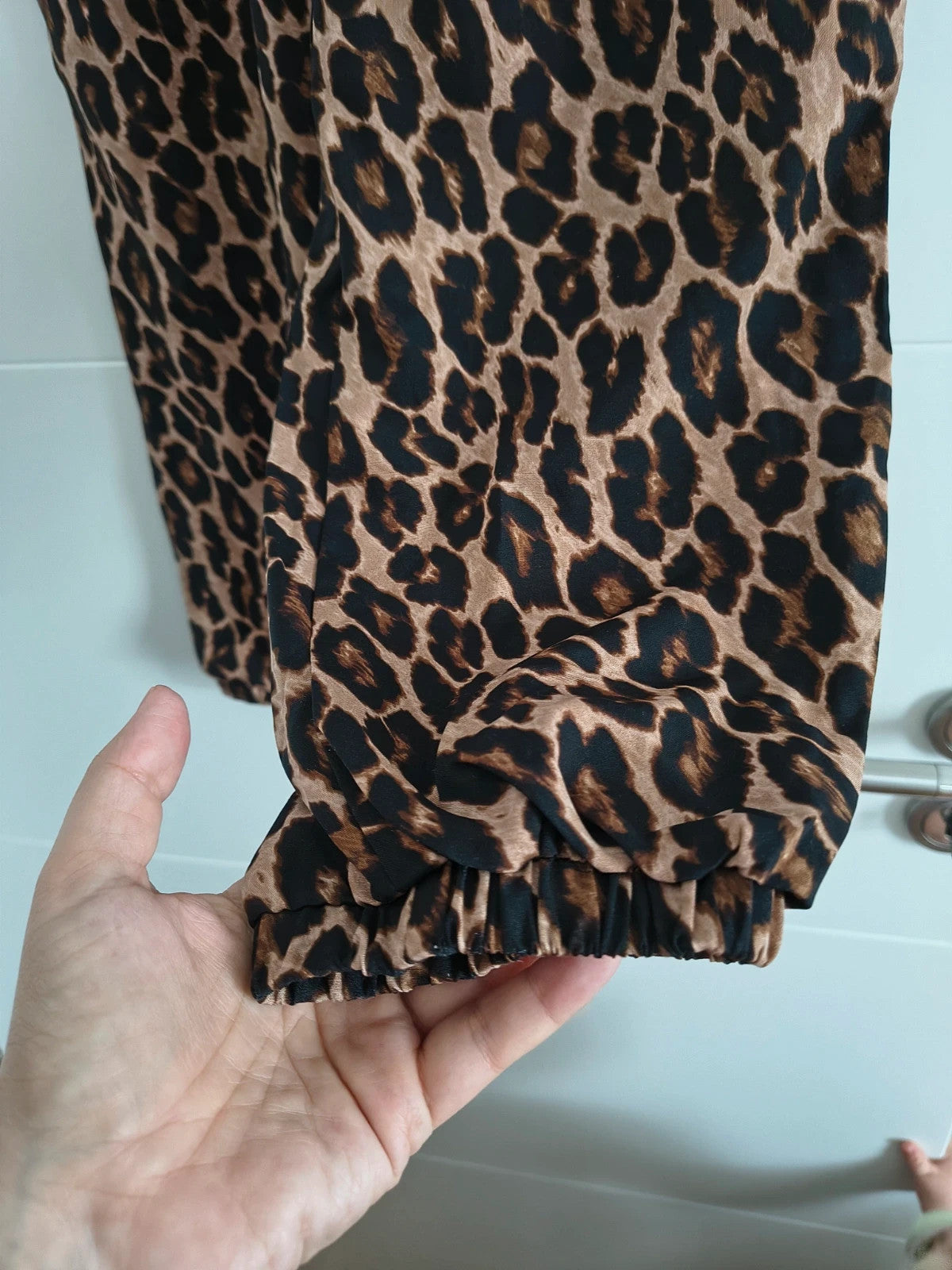SheIn joggers black and brown leopard print synthetic material with elastic waistband.