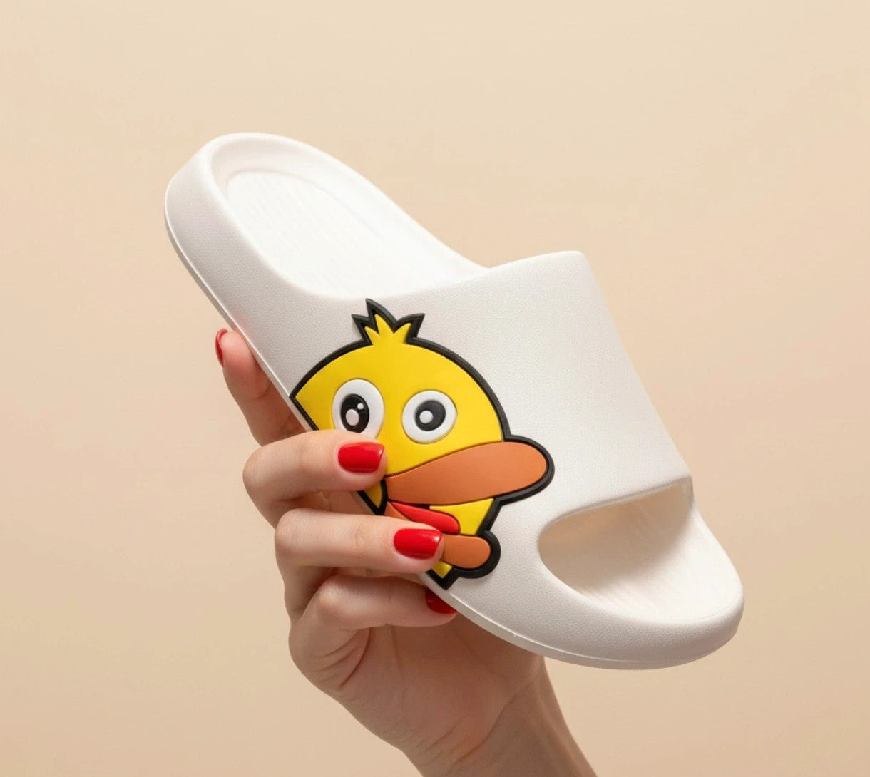 Slipper white and yellow slides with cartoon print and synthetic material.