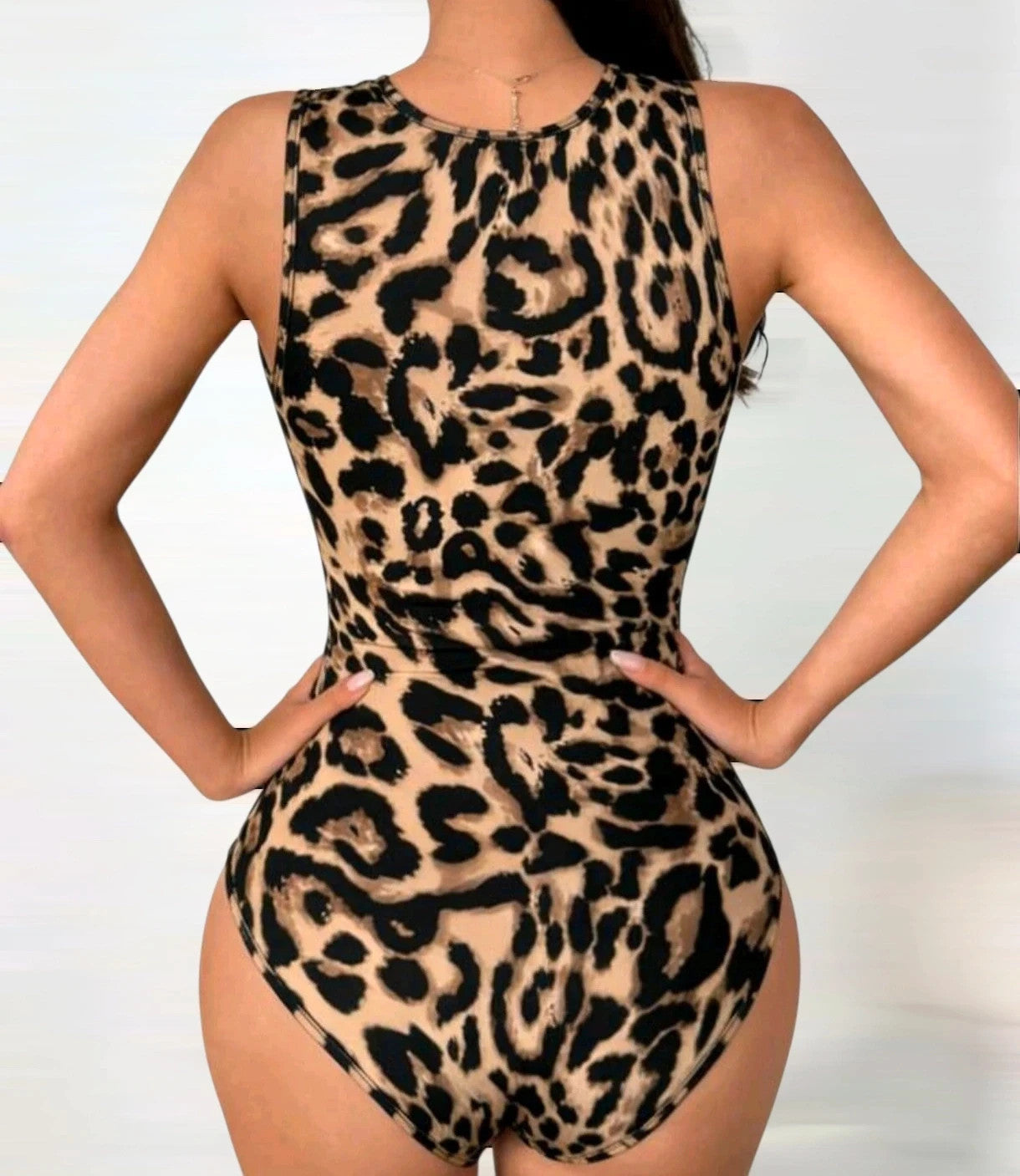 SheIn black and brown leopard print romper synthetic material with animal pattern.