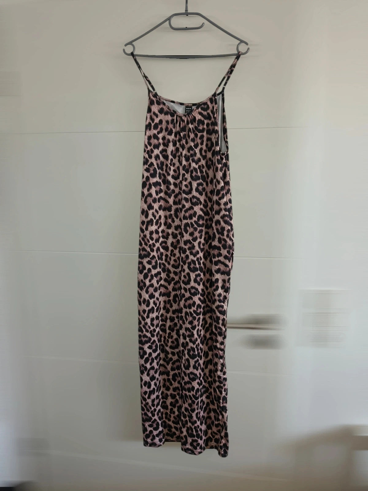 SheIn beige and brown jumpsuit with leopard print pattern and sleeveless design.