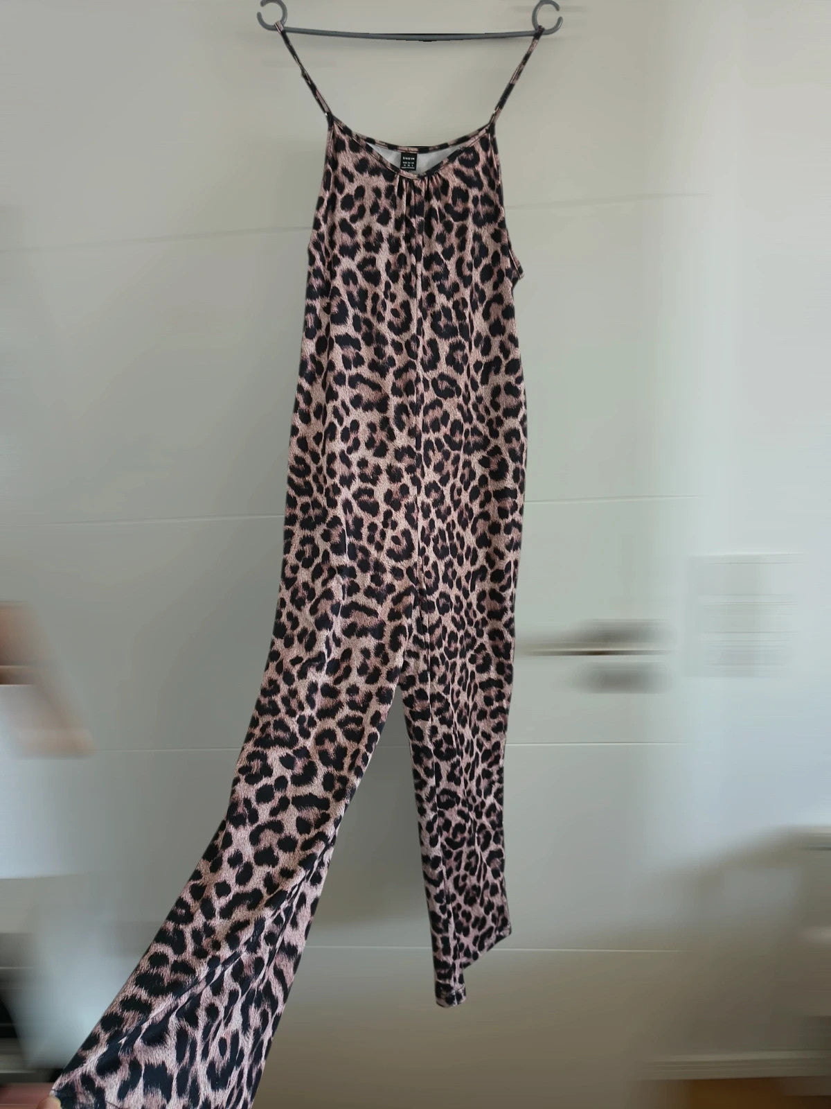 SheIn beige and brown jumpsuit with leopard print pattern and sleeveless design.