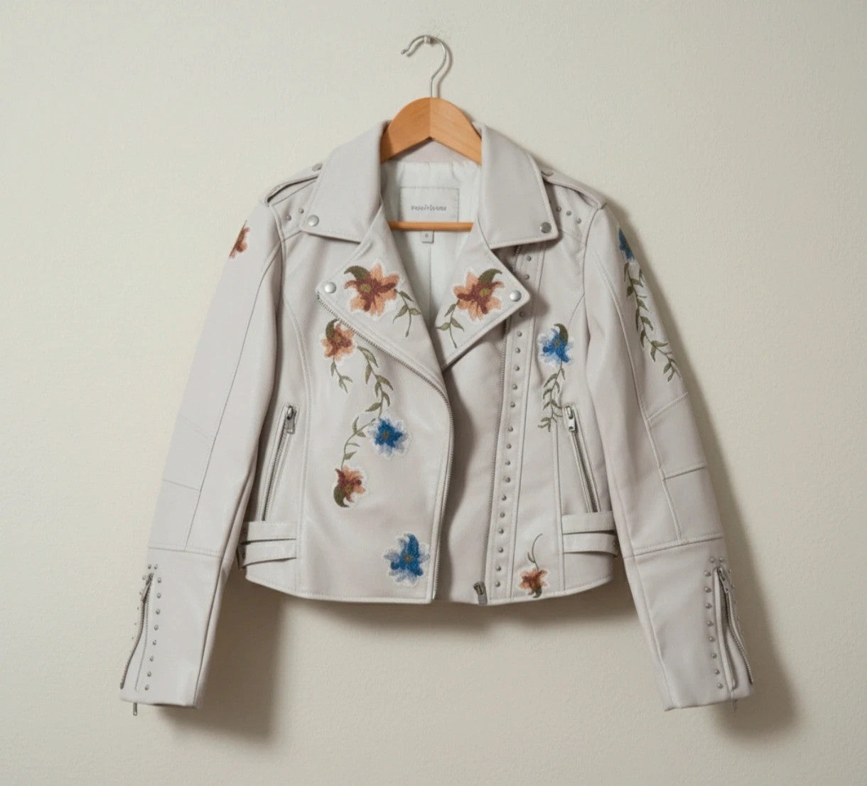 Brand New beige and orange biker jacket with floral pattern in synthetic material.