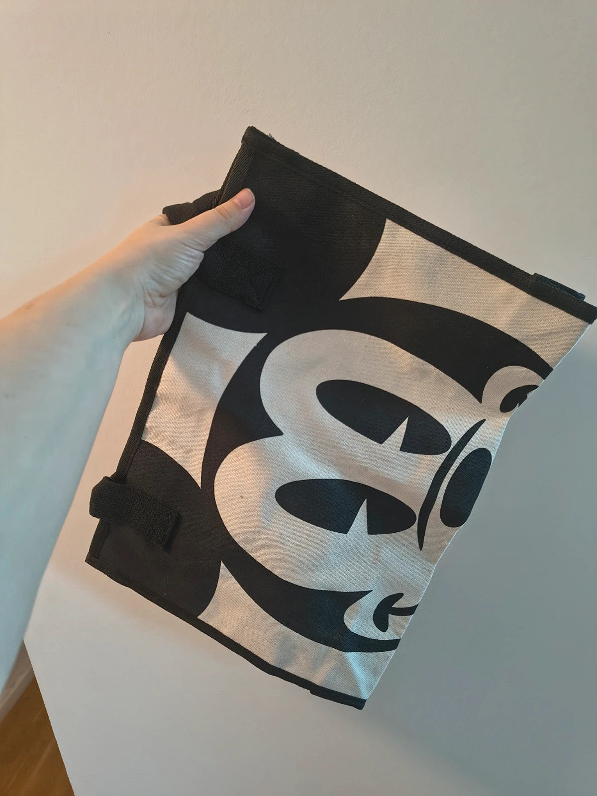 One Size black and cream shopping tote with zipper, synthetic and textile material.