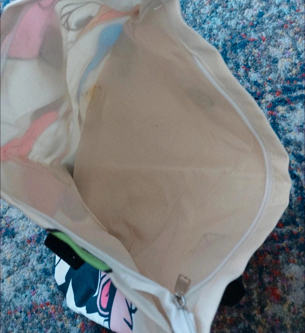 Kleine Tasche cream shopping tote with colorful cartoon comic print and sturdy handles.