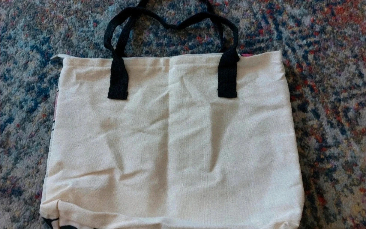 Kleine Tasche cream shopping tote with colorful cartoon comic print and sturdy handles.