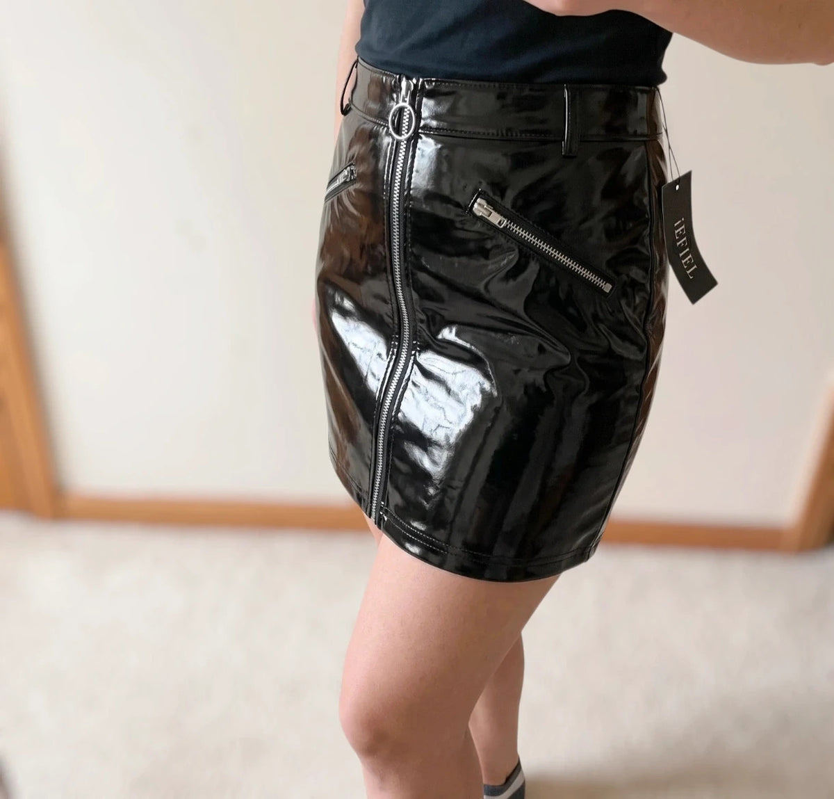REI black mini skirt with zipper, synthetic latex look, size M, labeled as XL.
