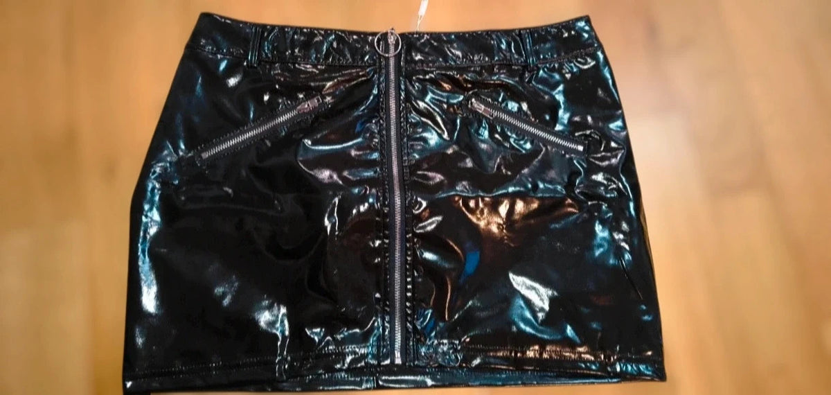 REI black mini skirt with zipper, synthetic latex look, size M, labeled as XL.