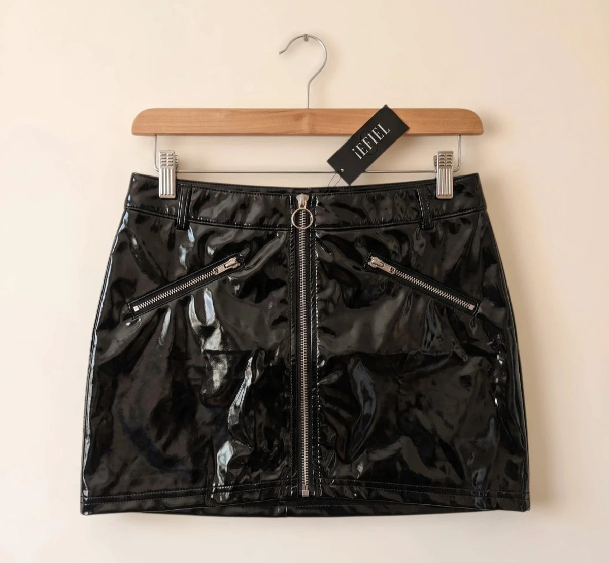 REI black mini skirt with zipper, synthetic latex look, size M, labeled as XL.