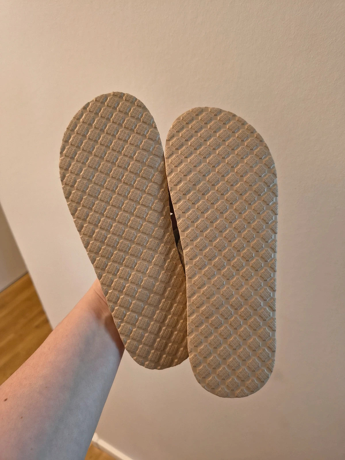 ALS beige slides synthetic material with subtle logo detailing.