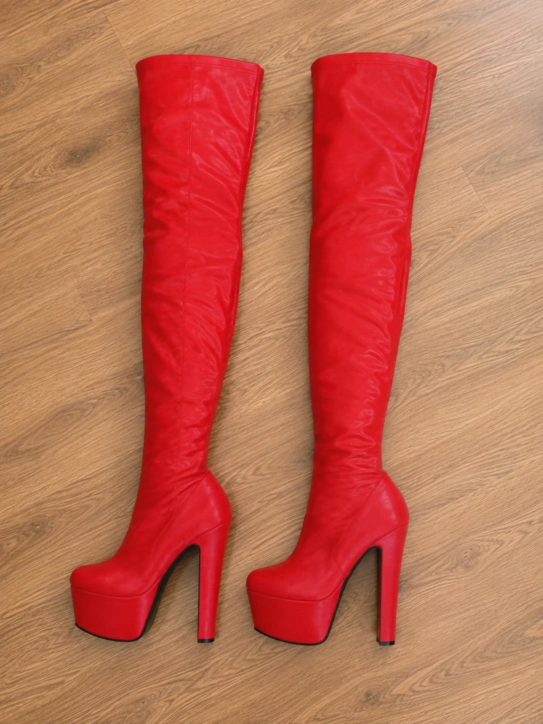 ALS red overknee plateau boots with thick stiletto heel and soft interior.