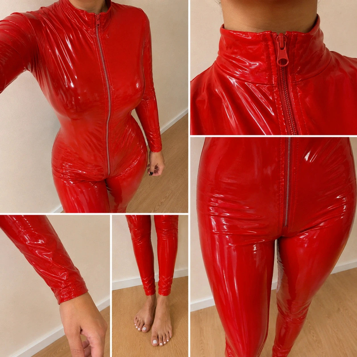 REI red wetlook overall with high collar and full zipper, figure-hugging fit.