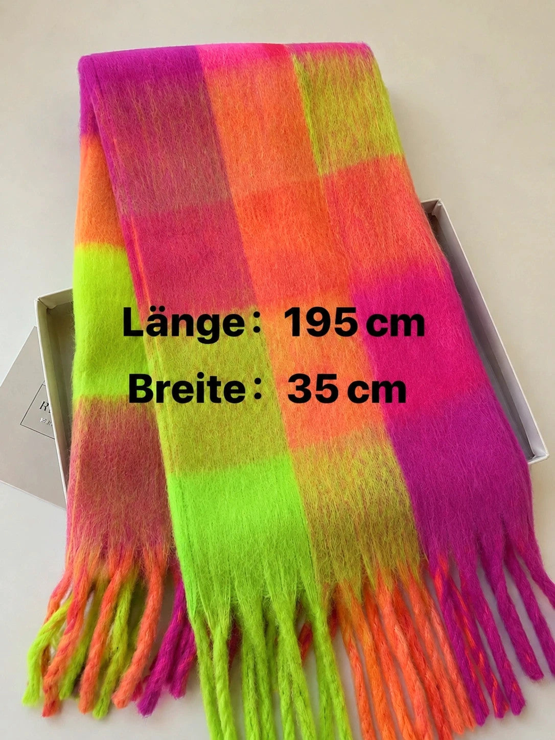 XXL multi-coloured scarf in neon pink, orange, green with fringe and check pattern.