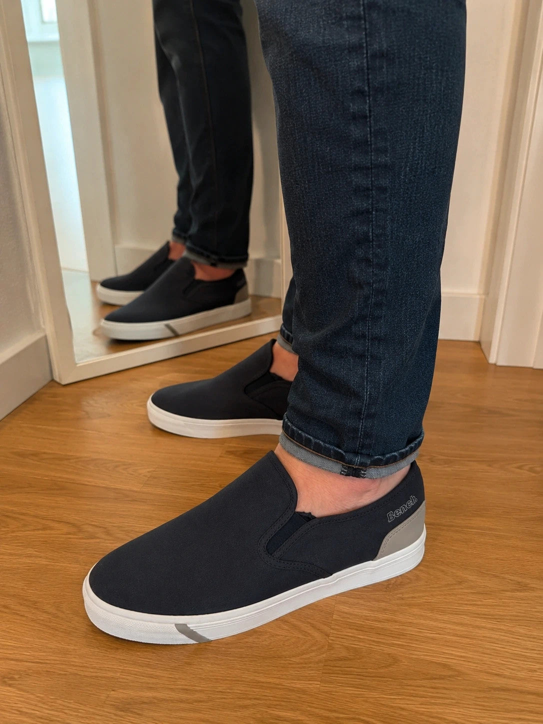 Bench blue slip-on trainers with light sole and gray heel detail.