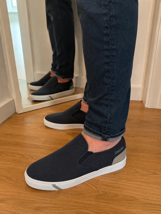 Bench blue slip-on trainers with light sole and gray heel detail.