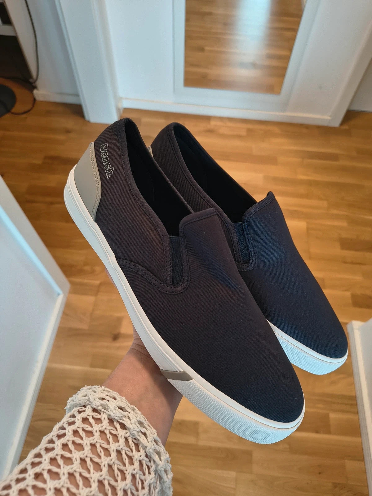 Bench blue slip-on trainers with light sole and gray heel detail.