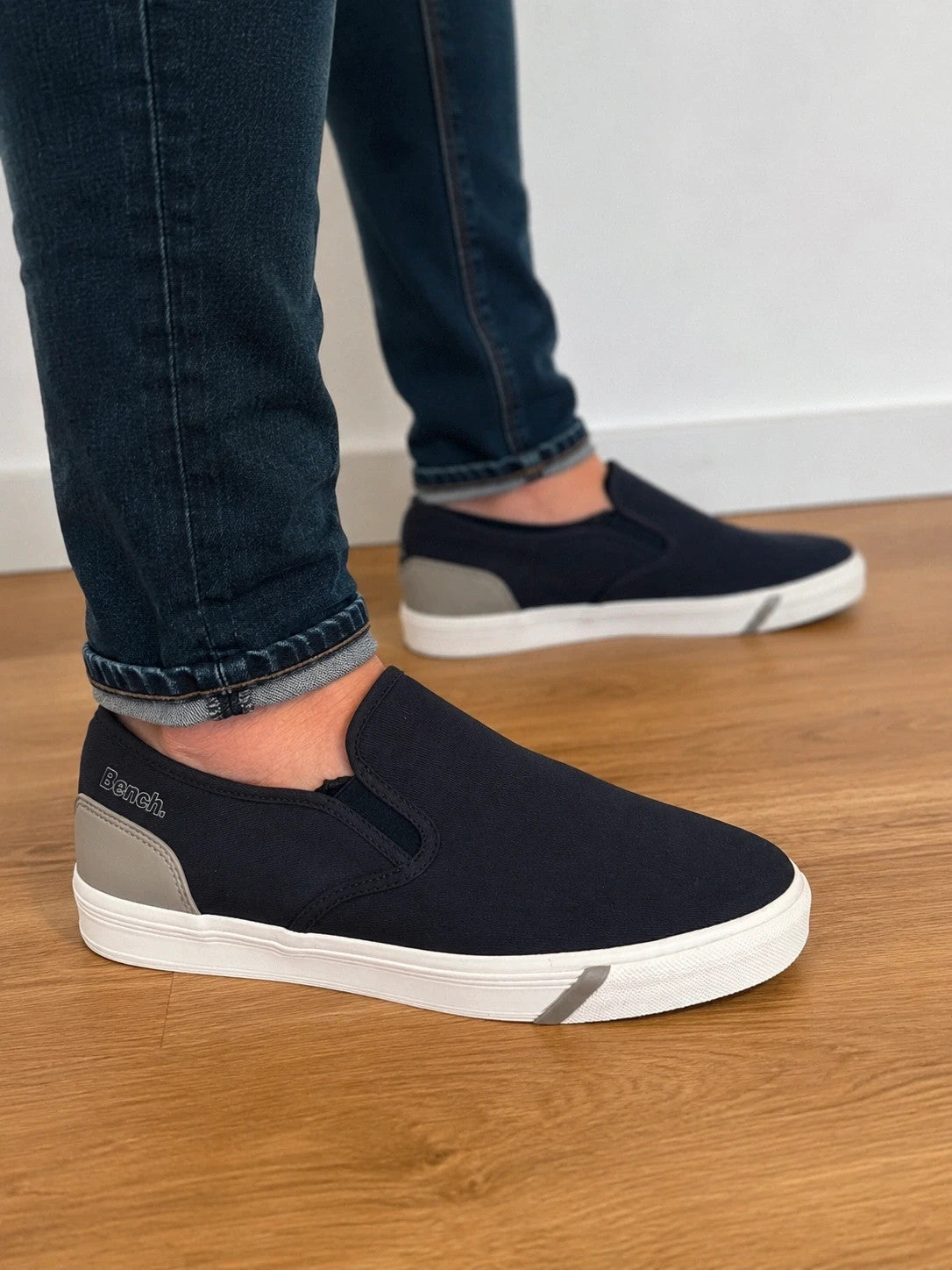 Bench blue slip-on trainers with light sole and gray heel detail.