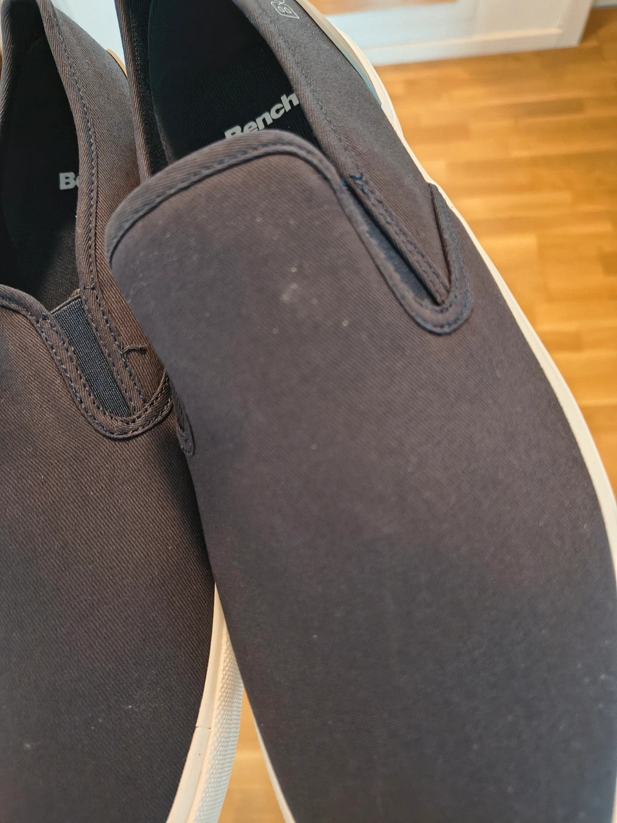 Bench blue slip-on trainers with light sole and gray heel detail.