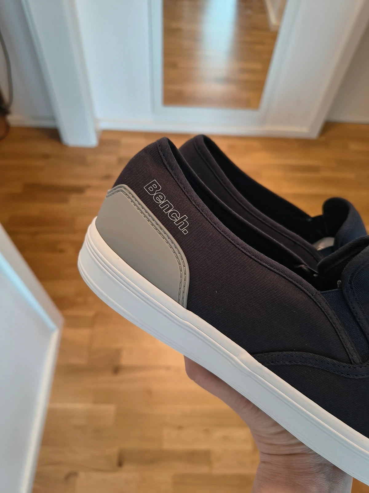 Bench blue slip-on trainers with light sole and gray heel detail.