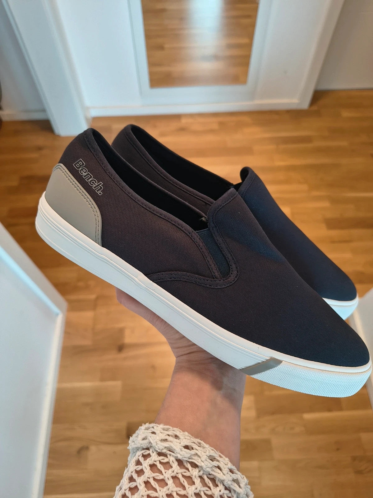 Bench blue slip-on trainers with light sole and gray heel detail.